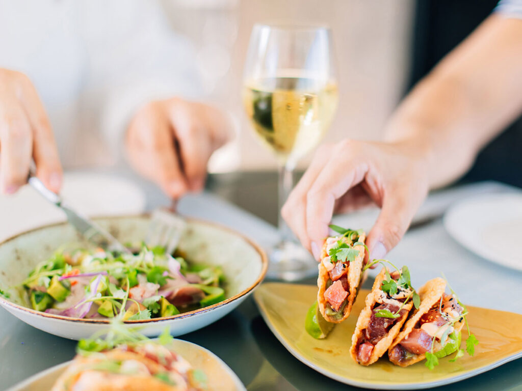 table with plate of food and drinks