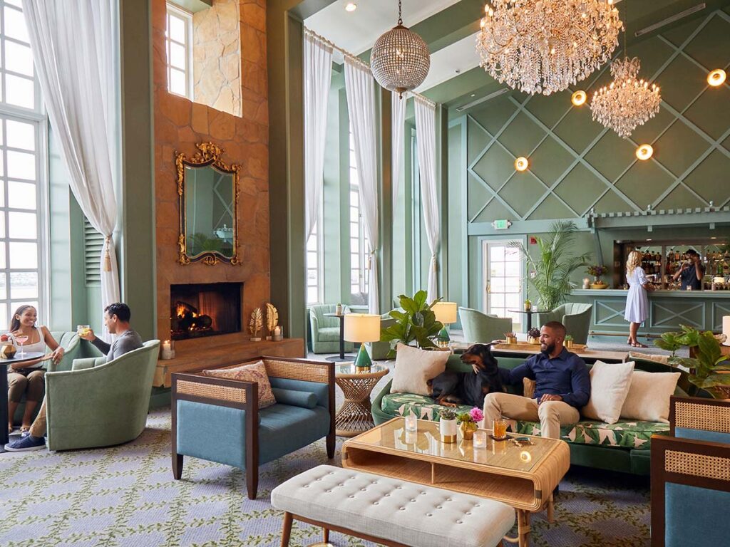 people relaxing with drinks at hotel portofino lobby